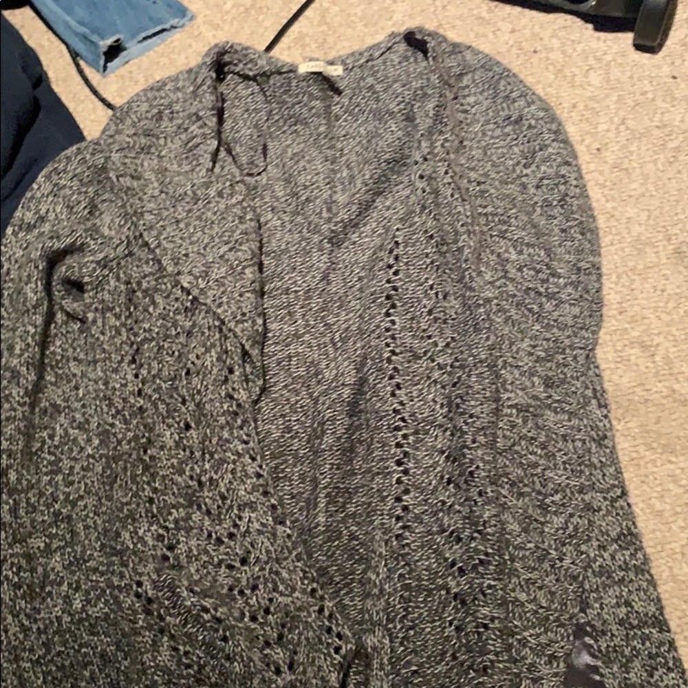 Grey knitted throw over